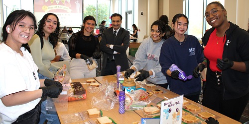 Interim Dean Kalliny with students