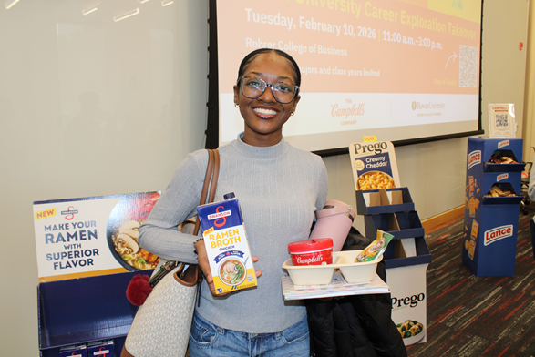 A student at the event with snacks from Campbell's