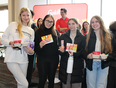 Four students showing off their snacks from Campbell's
