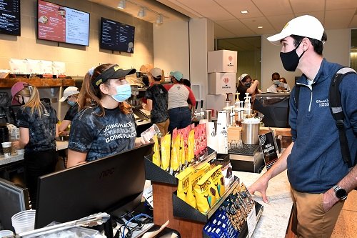 Student ordering coffee at the Saxby's counter