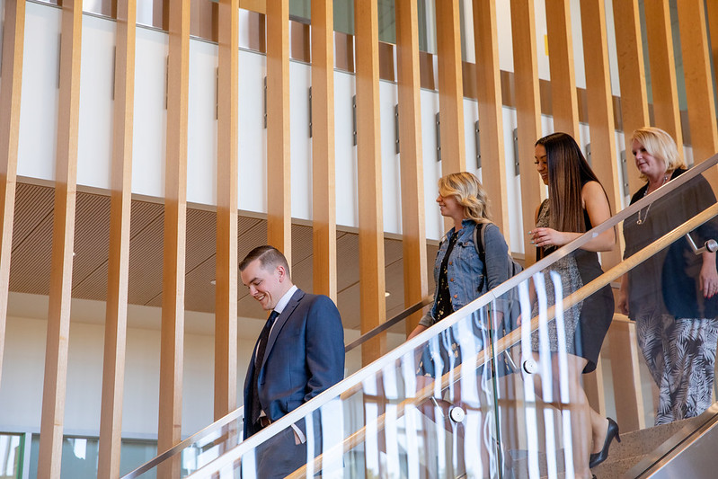 Grad students walking down the stairs