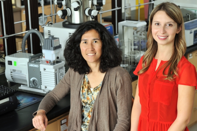 Two researchers standing in front of a groundbreaking project
