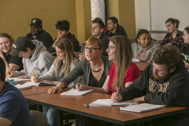 students in class taking notes